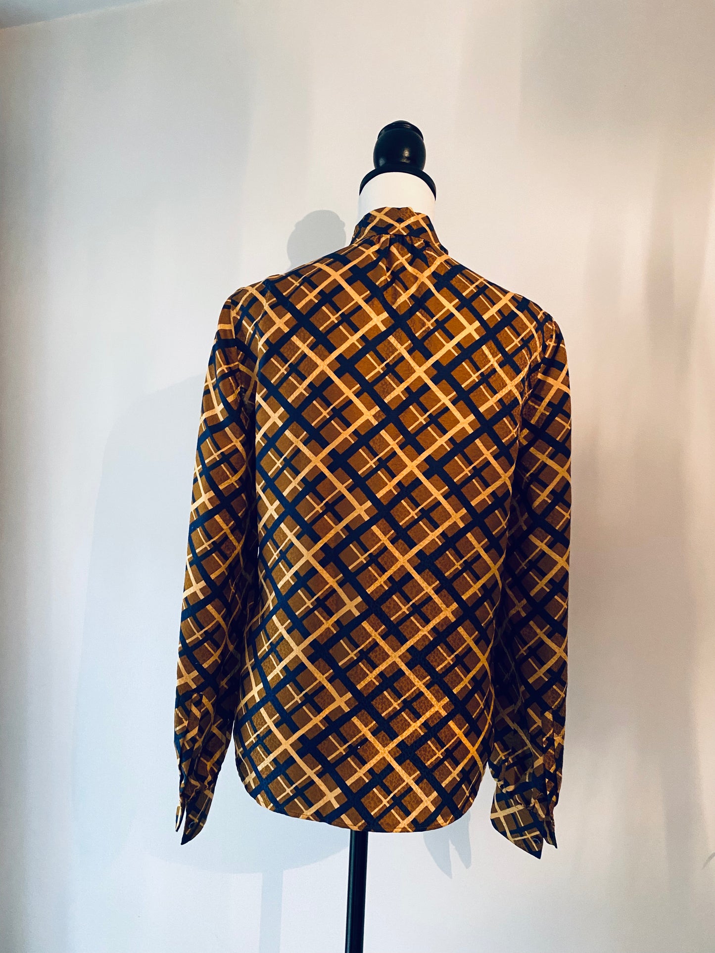 Saint Laurent geometric silk pussy bow blouse.